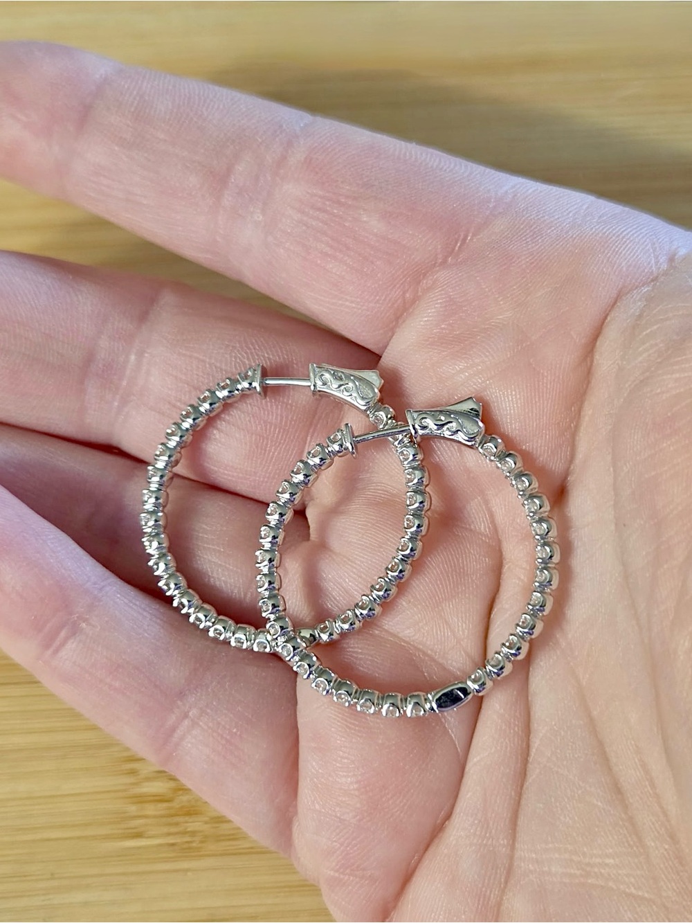 Locking 1.8ctw Moissanite inside-out hoops take you from the office to the club!